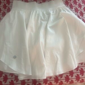 Lululemon white court rival skirt with built in shorts . Size 2 .